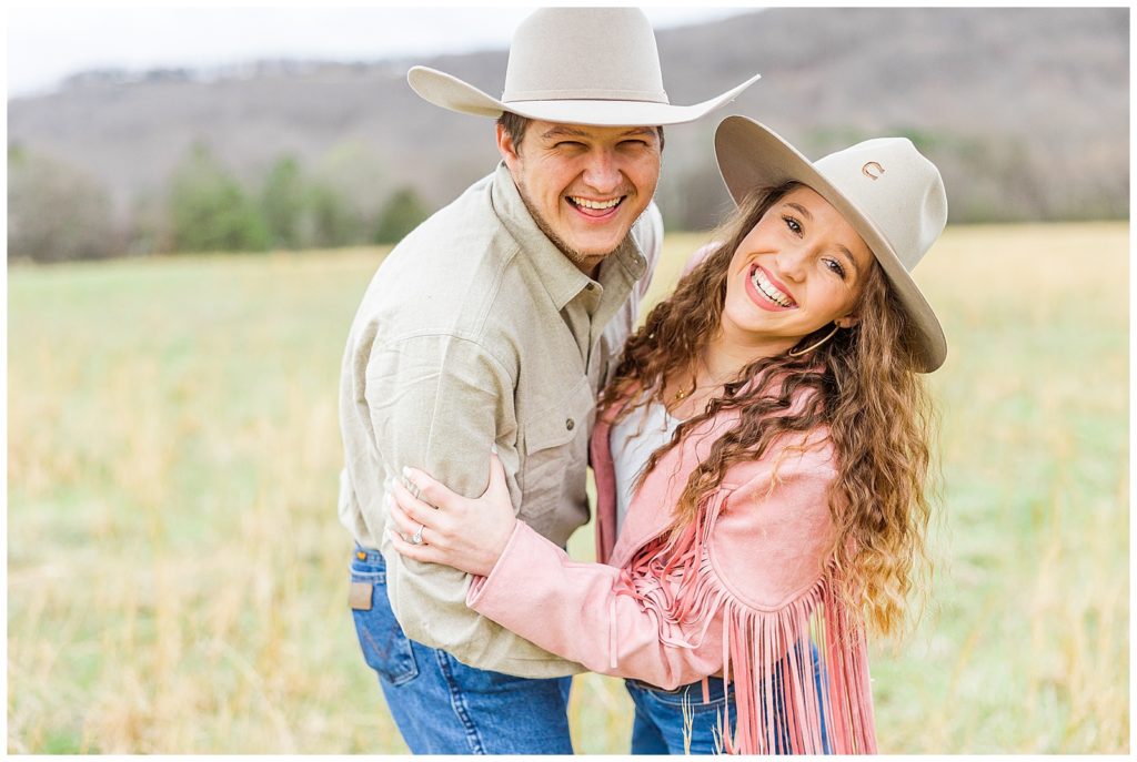 cowboy and cowgirl smiling 