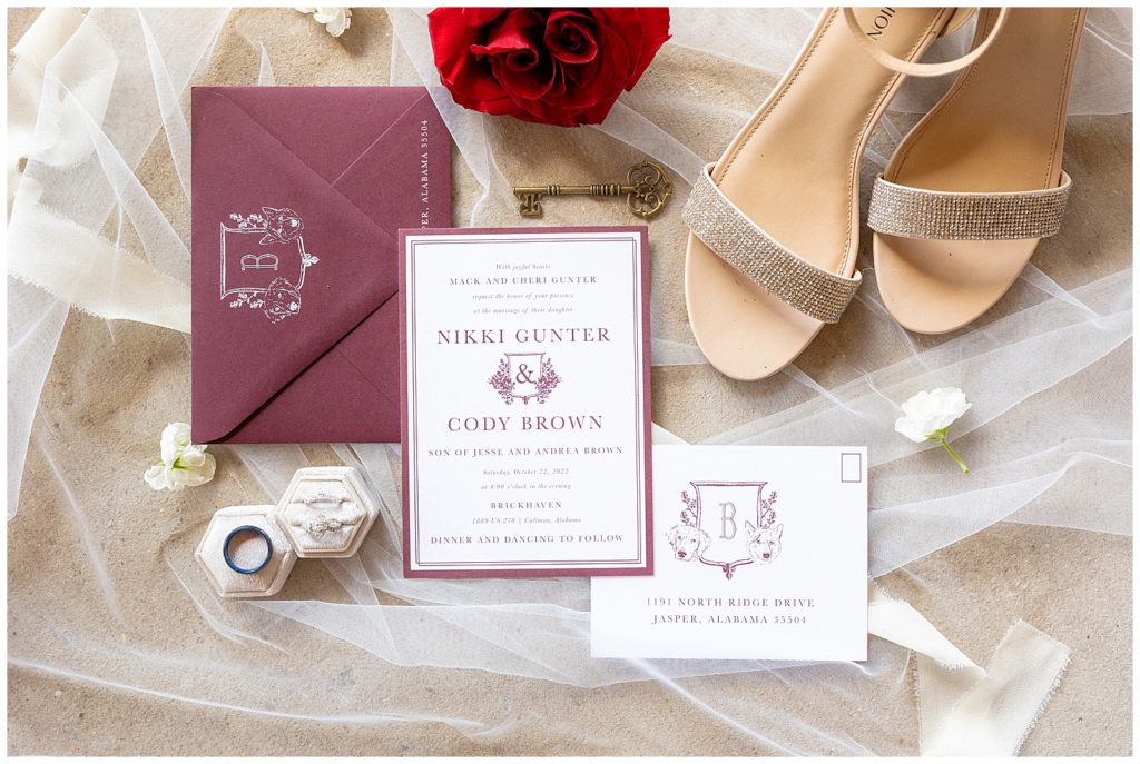 wedding flat lay with invitations and shoes