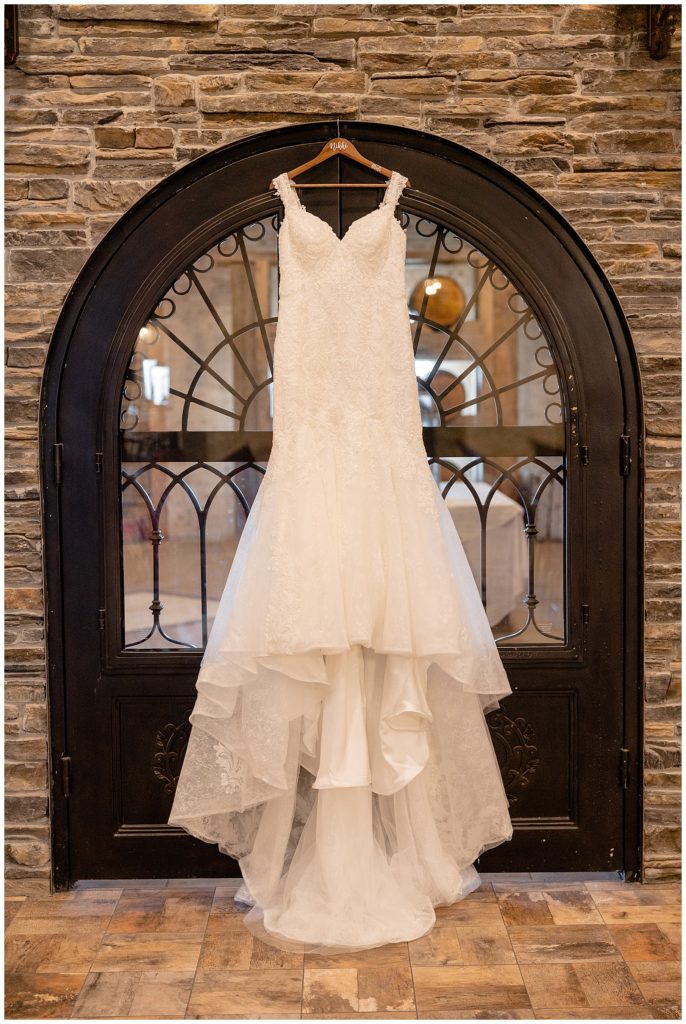 white wedding dress on black door 