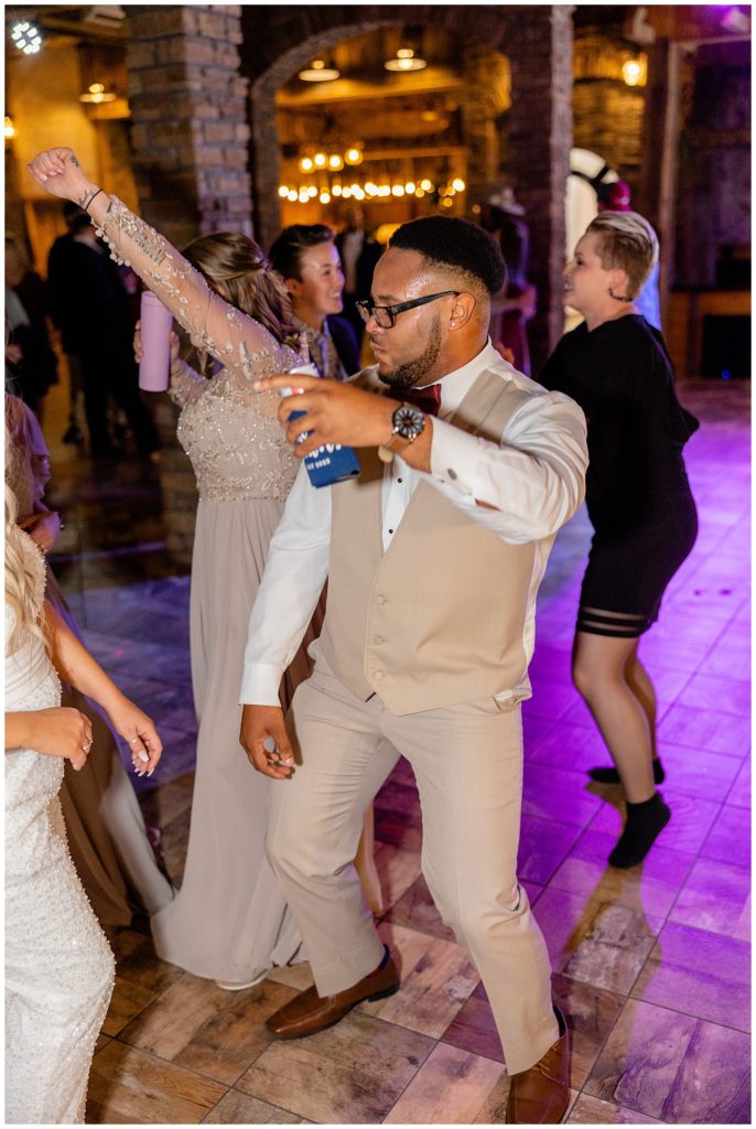 bridesman dancing at wedding reception brick haven